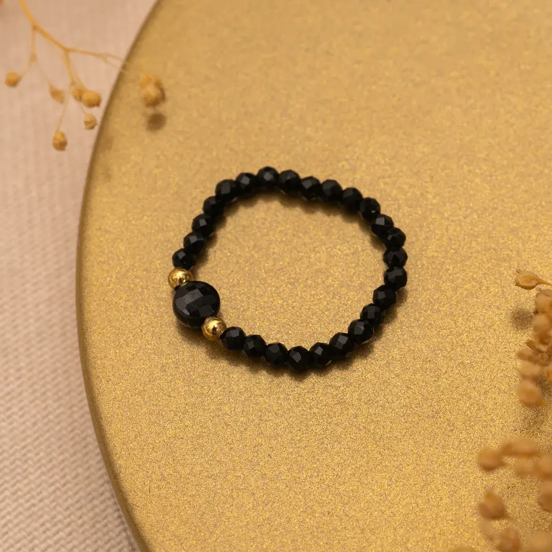 Pierścionek elastyczny czarny turmalin złoty stal 316l